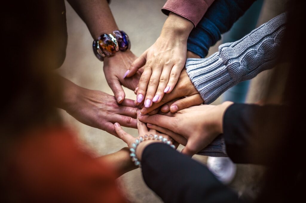 Relationships: a group of people showing their hands as a show of solidarity